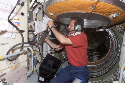 Treschev uses an amateur radio in the FGB during Expedition Five on the ISS