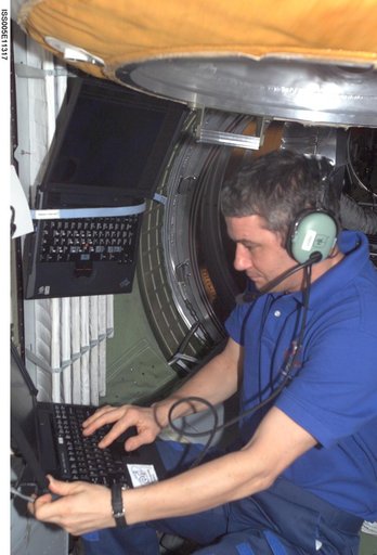 Korzun uses an amateur radio in the FGB during Expedition Five on the ISS