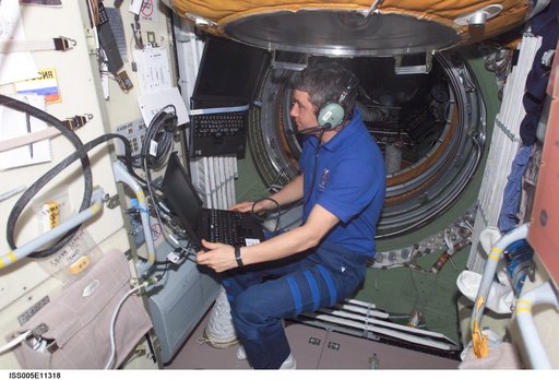 Korzun uses an amateur radio in the FGB during Expedition Five on the ISS