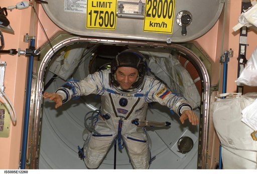 Korzun moves through Node 1 hatch wearing his Russian Sokol suit during Expedition Five