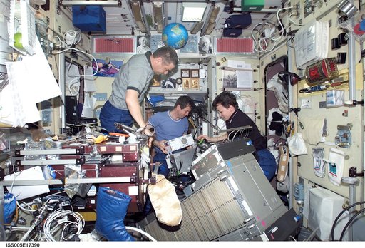 Expedition Five crew perform maintenance on the TVIS