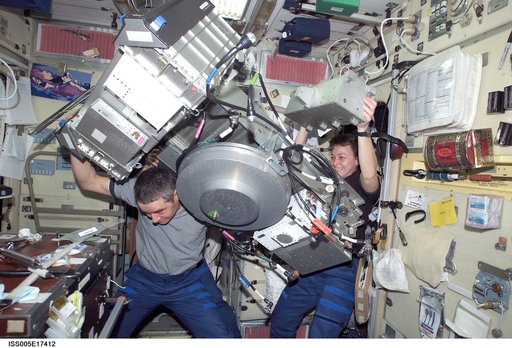 Expedition Five crew perform maintenance on the TVIS