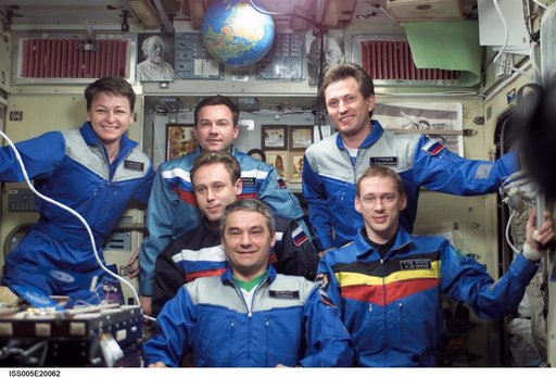Soyuz Five and Expedition Five crew pose in the SM during Expedition Five on the ISS