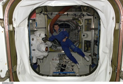 Astronaut Peggy Whitson floats in the Quest/Airlock during Expedition Five on the ISS