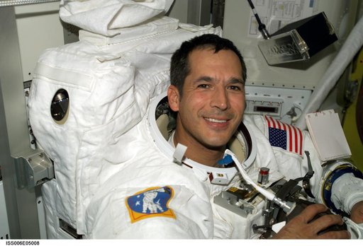 STS-113 Mission Specialist Herrington wearing an EMU Spacesuit while in the Quest Airlock
