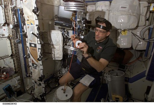 Pettit conducts maintenance on the RED equipment in the U.S. Laboratory