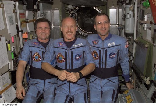 Expedition Six crewmembers pose for a group photo in the Service Module