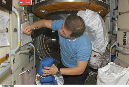 Budarin takes inventory of medical equipment on the FGB during Expedition Six