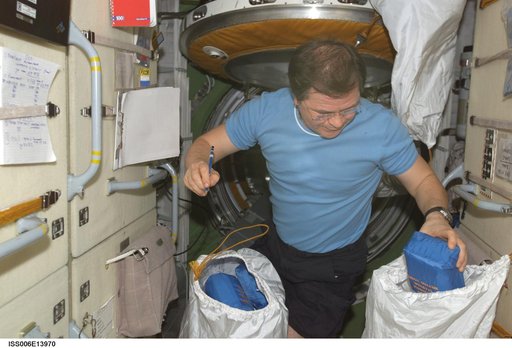 Budarin takes inventory of medical equipment on the FGB during Expedition Six