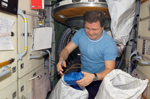Budarin takes inventory of medical equipment on the FGB during Expedition Six
