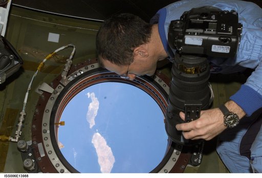 Pettit takes pictures of Earth from the window in Destiny during Expedition Six