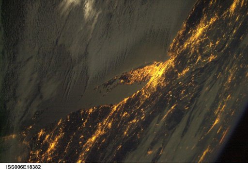Crew Earth Observations (CEO) of the Aurora Borealis and city lights taken during Expedition Six