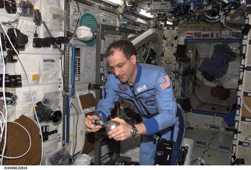Pettit uses a Grab Sample Container in the U.S. Laboratory during Expedition Six
