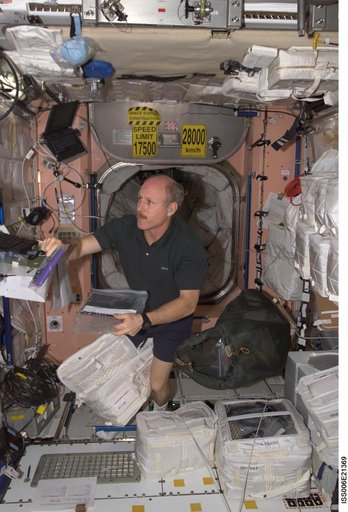 Bowersox works at a laptop computer in Node 1 during Expedition Six
