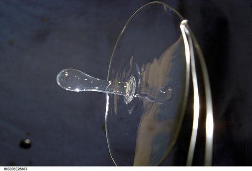 View of a surface tension demonstration using water that is being held in place by a 50mm metal loop