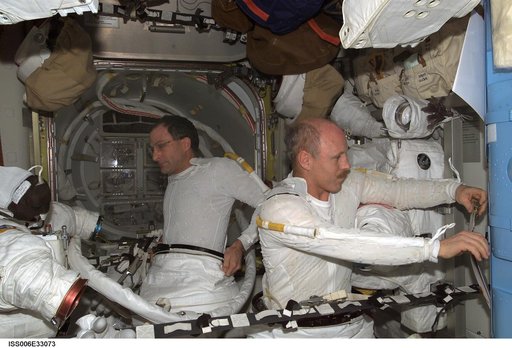 Bowersox and Pettit are preparing for an EVA DTO in the Quest Airlock during Expedition Six