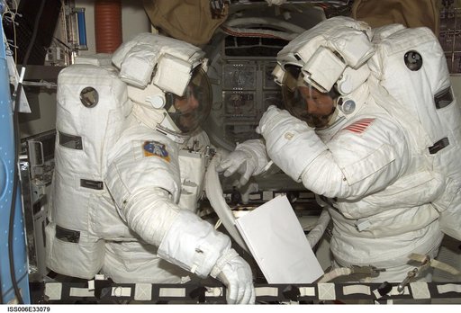 Bowersox and Pettit are wearing EMU's in the Quest Airlock during Expedition Six