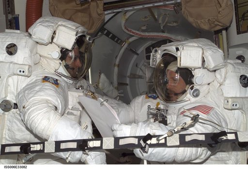 Bowersox and Pettit are wearing EMU's in the Quest Airlock during Expedition Six