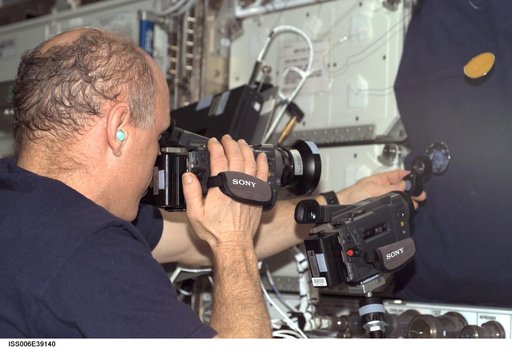 Commander Kenneth D. Bowersox photographs a water bubble within a 50-millimeter metal in U.S. Lab