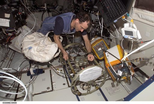 Flight Engineer Donald R. Pettit making a valve adjustment to the FCPA