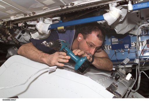 Flight Engineer Donald R. Pettit is disassembling framework of the ITCS