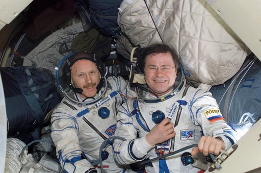Bowersox and Budarin wearing Russian Sokol suit in Soyuz Spacecraft during Expedition Six