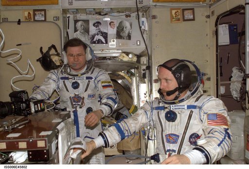 Budarin and Bowersox wearing Russian Sokol suits in the Soyuz Spacecraft during Expedition Six