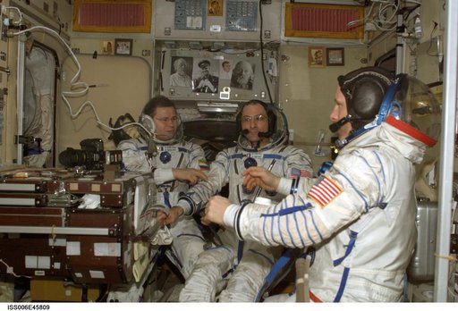 Informal portrait of Pettit, Budarin, and Bowersox in the SM during Expedition Six