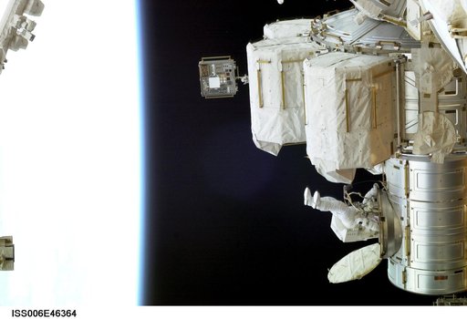 View of Flight Engineer Donald R. Pettit emerging from the Quest/Airlock to perform tasks