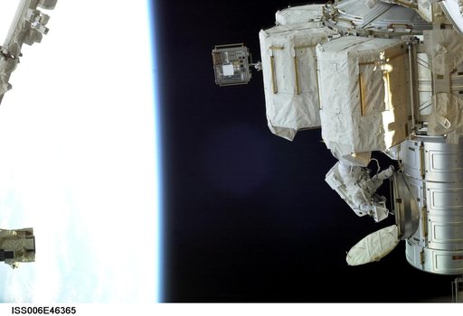View of Flight Engineer Donald R. Pettit emerging from the Quest/Airlock to perform tasks