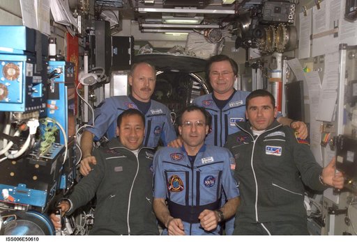Expedition Six and Seven crews pose for a group photo in the SM