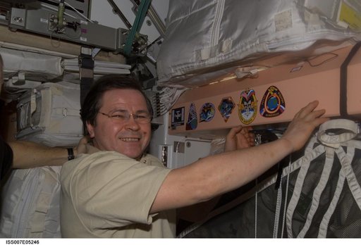 Expedition Six crewmember Budarin with mission patch in Unity /Node 1