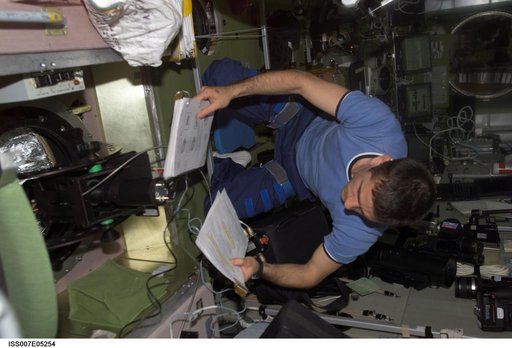 Expedition Seven CDR Malenchenko at work in Zvezda Service module