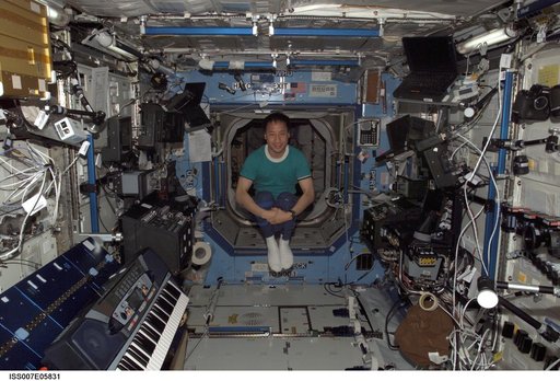 Expedition Seven Science Officer Ed Lu tumbles through the Destiny laboratory