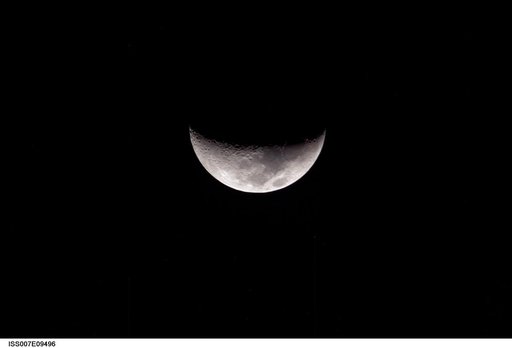 A partial moon was photographed by an Expedition 7 crewmember