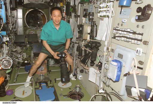 Expedition Seven Lu in Zvezda with camera