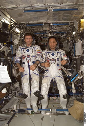 Expedition Seven Malenchenko and Lu wearing Sokol pressure suit in Destiny laboratory