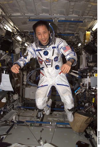 Expedition Seven Lu wearing Sokol pressure suit in Destiny laboratory