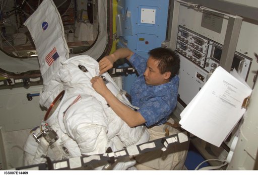 Expedition Seven Lu with EMU in Quest airlock