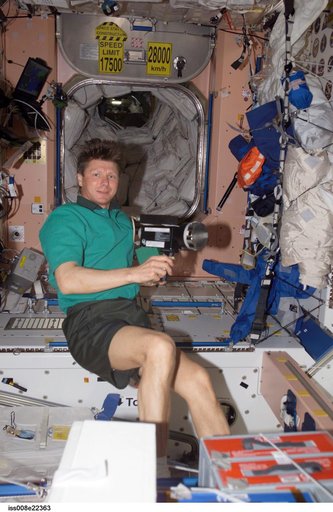 Padalka collects air samples in the SM during Expedition 9 / Expedition 8