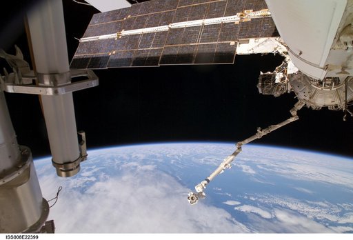 Strela boom, FGB, PMA3, U.S. Lab, and SSRMS as seen during Expedition 8 EVA operations