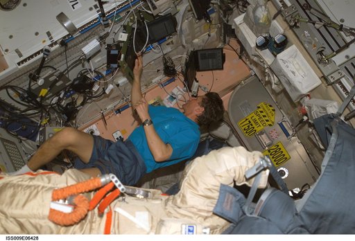 Padalka prepares to checkout an Orlan suit during Expedition 9