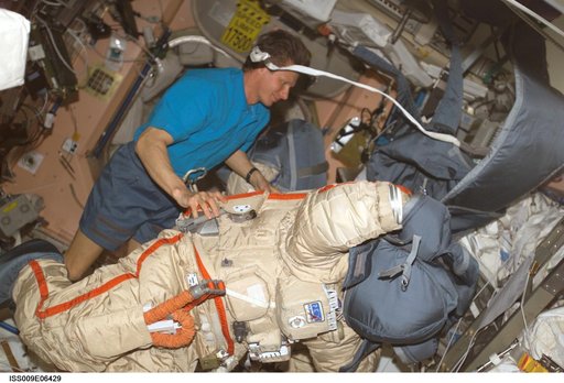 Padalka checks out an Orlan suit during Expedition 9