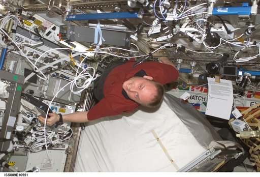 Fincke unstows a spare RPCM from the U.S. Lab during Expedition 9