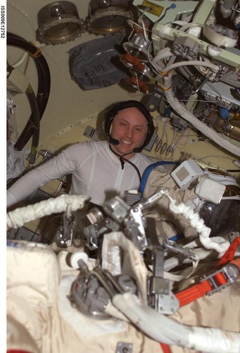 Fincke conducts final COM checks on his Orlan suit before an EVA during Expedition 9