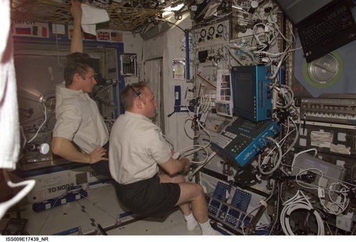 Fincke performs an ultrasound bone scan on Padalka using the ADUM in the U.S. Lab during Expedition 9