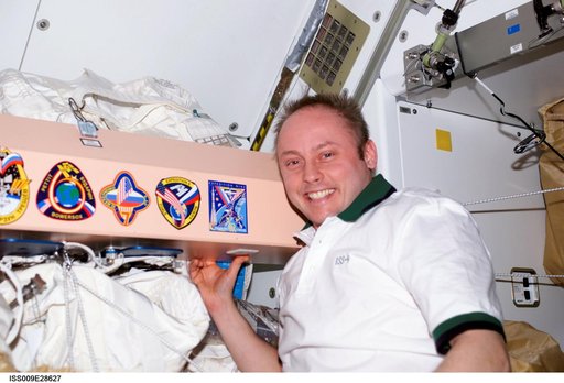 Fincke with Expedition 9 mission patch sticker on panel in the Node 1 module during Expedition 9