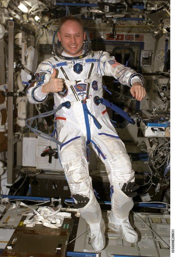 Fincke wears his Russian Sokol pressure suit in the U.S. Lab module during Expedition 9