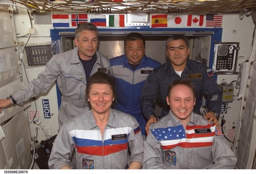 Expedition 9 and 10 crewmembers pose for a crew photo during Exp. 9/10 joint operations