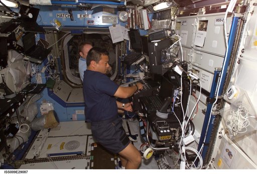 Chiao and Fincke work at the SSRMS workstation as they conduct Robotic Handover OPS during Expedition 9/10 joint OPS